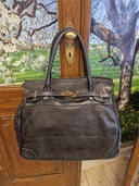 Kelly bag nera in pelle lavata, effetto vintage
